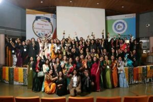 Large group celebrating achievements at an education alumni or felicitation event