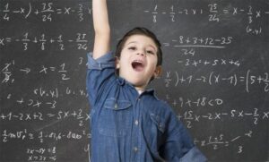 Confident student raising hand in classroom with math equations on the blackboard, showing improved learning across subjects.