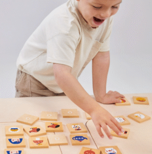 Young child playing an educational matching game to improve memory and thinking skills.