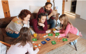 Family playing educational math games together to support children's learning and cognitive development.